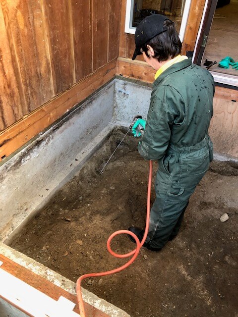 Termite treatment into the trench, using top quality EPA regulated termiticide materials.