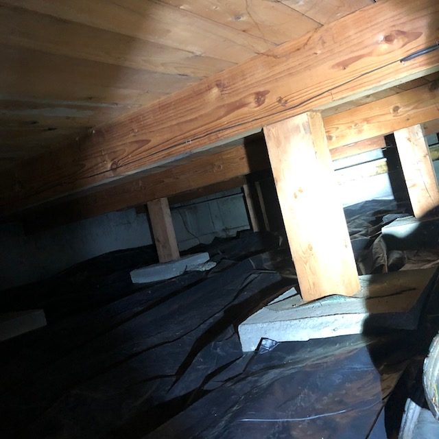 Vapor barrier installed in a crawl space